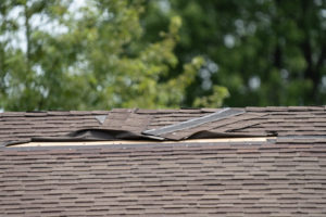 roof shingles have been damaged by heavy winds and strong storms