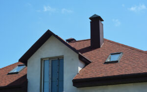 A Close-up Of An Asphalt Shingled Roofing Construction With Atti