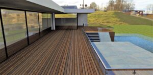 Wooden terrace of flat roof high tech house. 